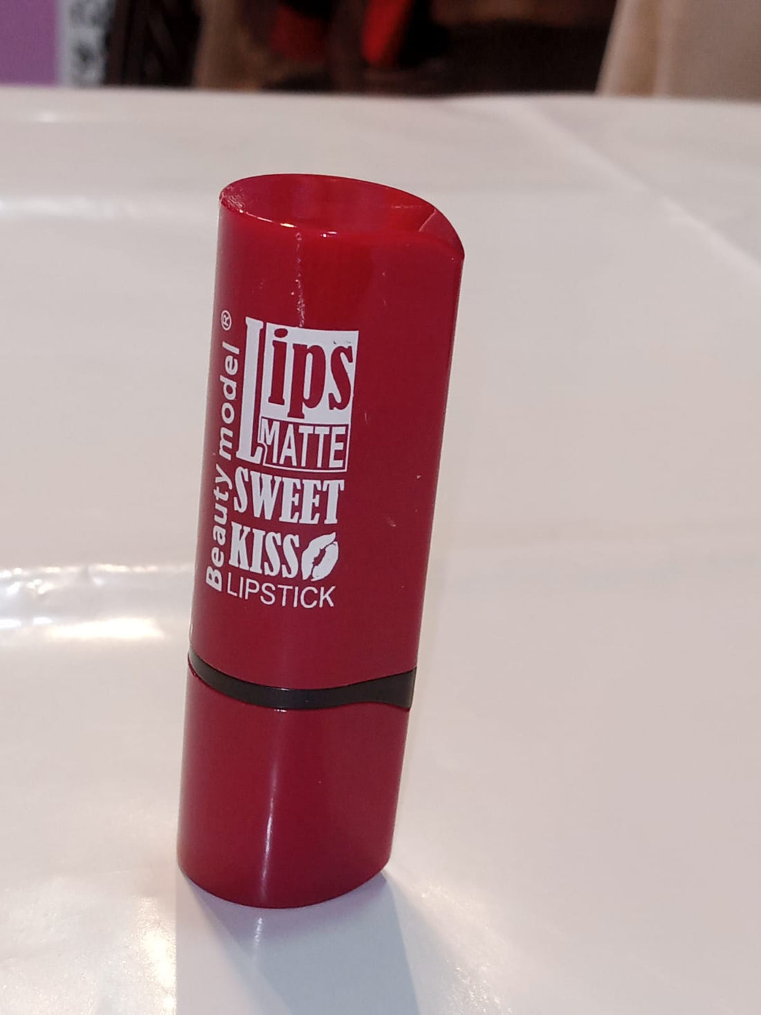 Red Matte Lipstick with Playful Typography Design